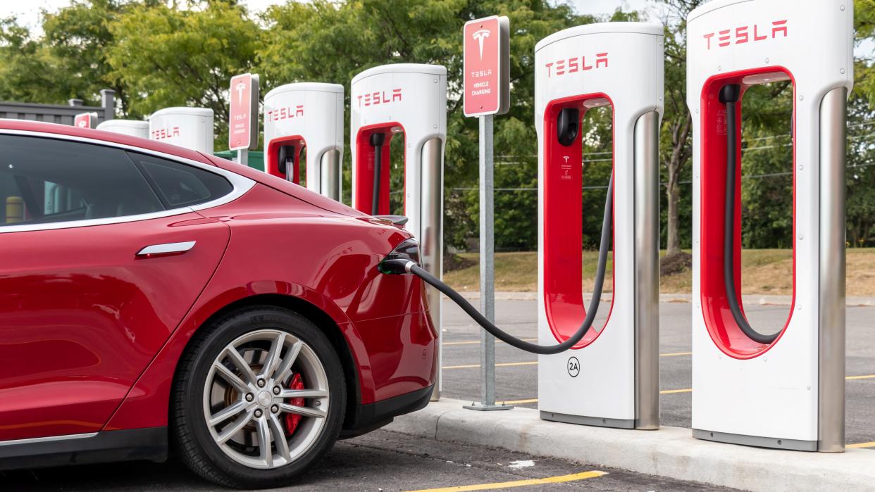  A Tesla Model 3 charging at a supercharger. 