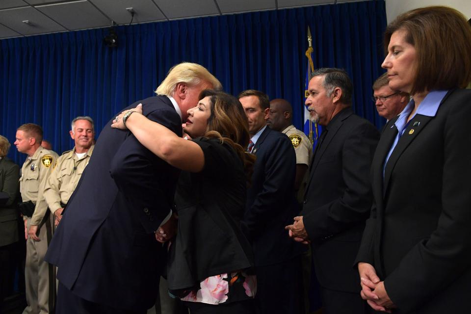 President Donald Trump salutes first responders as he visits the Metropolitan Police Department command center in Las Vegas on Oct. 4, 2017. (Photo: MANDEL NGAN via Getty Images)