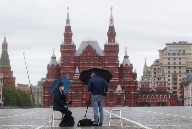 Journalists work in empty Red Square on Victory Day in central Moscow