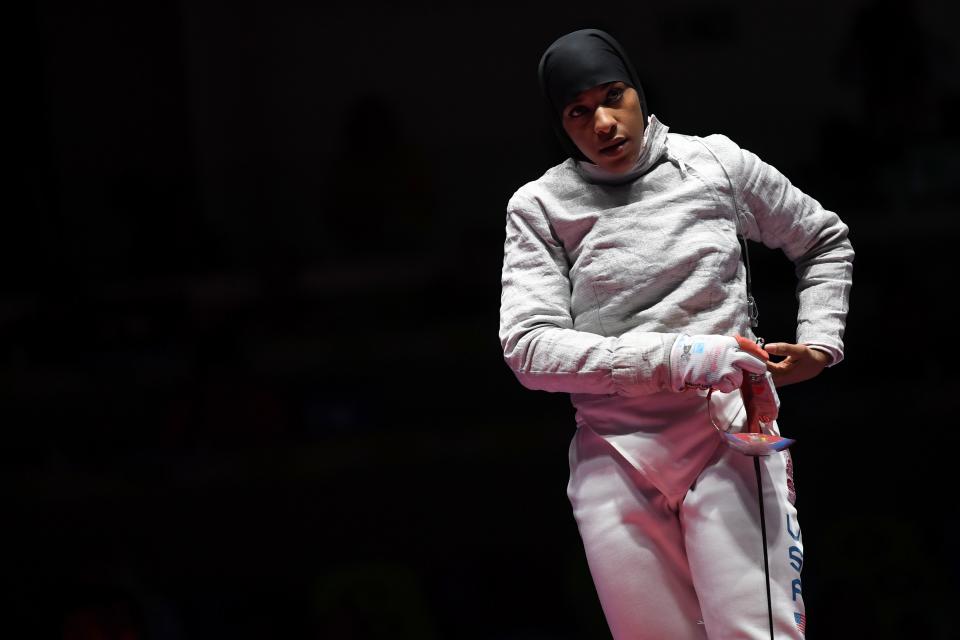 US Ibtihaj Muhammad reacts  during the womens team sabre bronze medal bout between US and Italy as part of the fencing event of the Rio 2016 Olympic Games, on August 13, 2016, at the Carioca Arena 3, in Rio de Janeiro. / AFP / Kirill KUDRYAVTSEV        (Photo credit should read KIRILL KUDRYAVTSEV/AFP via Getty Images)