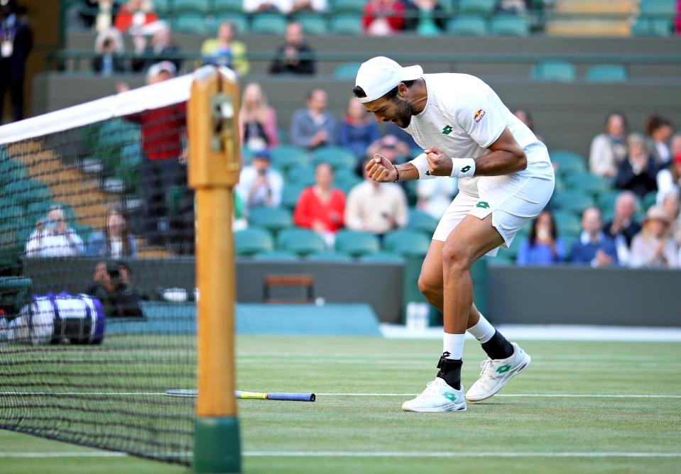 Matteo Berrettini celebrates winning (PA Wire)