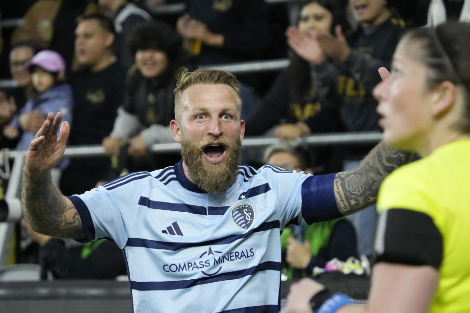 Sporting Kansas City forward Johnny Russell complains to a linesman about a call during the first half of a Major League Soccer match against Los Angeles FC Wednesday, May 17, 2023, in Los Angeles. (AP Photo/Mark J. Terrill)