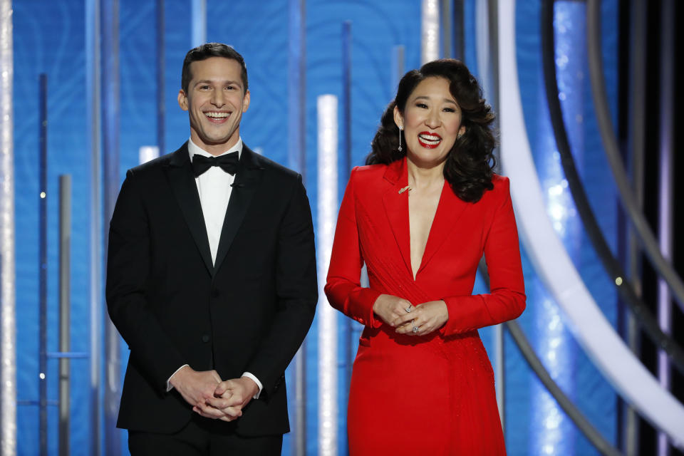 Hosts Andy Samberg and Sandra Oh speak onstage during the 76th Annual Golden Globe Awards.