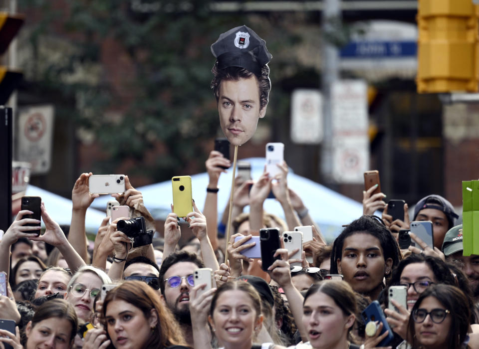 Fans waiting to see Harry Styles at the premiere of "My Policeman" at the Princess of Wales Theatre during the Toronto International Film Festival, Sunday, Sept. 11, 2022, in Toronto. (Photo by Evan Agostini/Invision/AP)