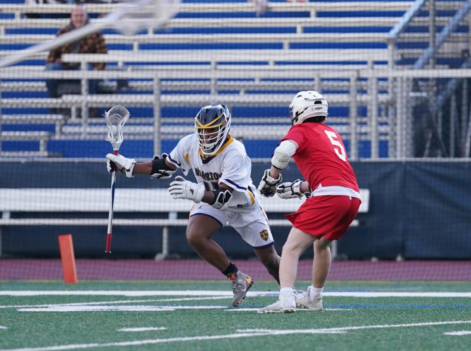 Lourdes' Alex Crysler in action during boys lacrosse action against Goshen on May 5, 2023.