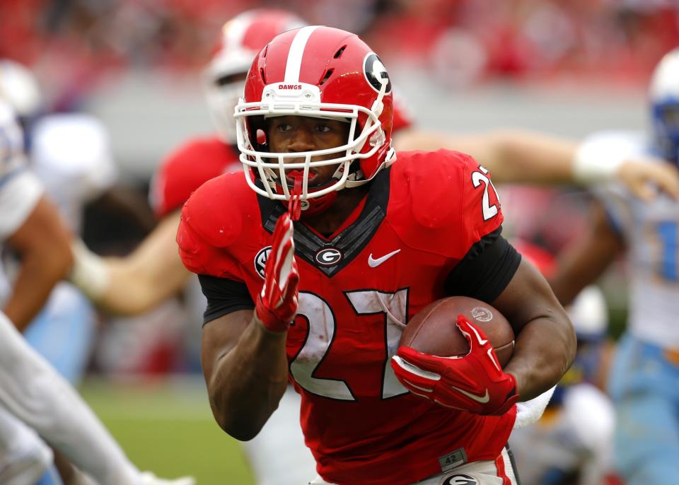 Chubb averaged over 8 yards per carry in 2015 before his injury (Getty). 