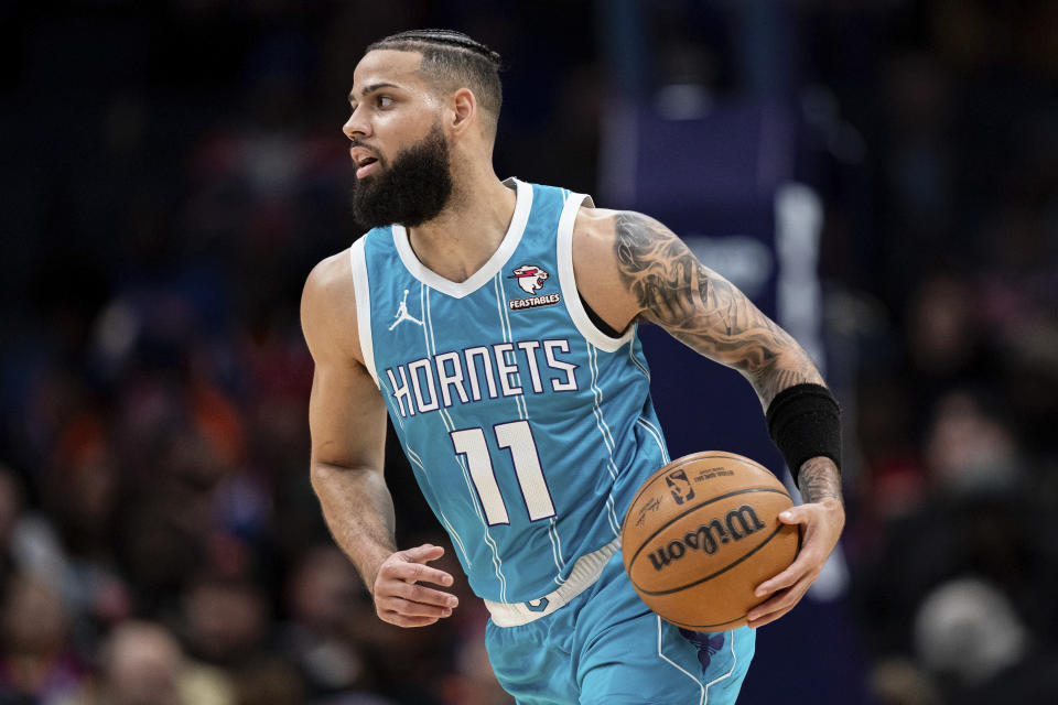 Charlotte Hornets forward Cody Martin brings the ball up court during the first half of an NBA basketball game against the New York Knicks, Monday, Jan. 29, 2024, in Charlotte, N.C. (AP Photo/Jacob Kupferman)