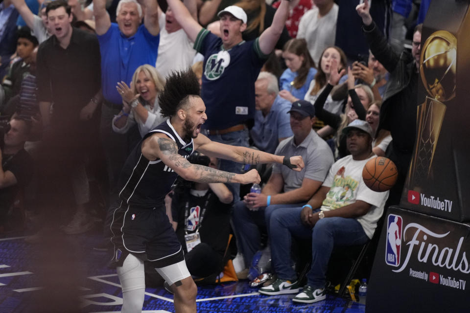 Dallas Mavericks center Dereck Lively II (2) celebrates a score against the Boston Celtics during the second half in Game 4 of the NBA basketball finals, Friday, June 14, 2024, in Dallas. (AP Photo/Julio Cortez)