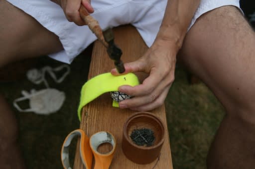 Nick Wood, the head professional at the Royal Tennis Court, makes a real tennis ball at Hampton Court Palace on July 20, 2018