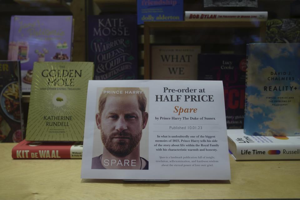 A promotional poster of the new book "Spare"is displayed in a bookstore in London, Thursday, Jan. 5, 2023. Prince Harry alleges in a much-anticipated new memoir that his brother Prince William lashed out and physically attacked him during a furious argument over the brothers' deteriorating relationship, The Guardian reported Thursday. The newspaper said it obtained an advance copy of the book, "Spare," due to be published next week. (AP Photo/Kin Cheung)