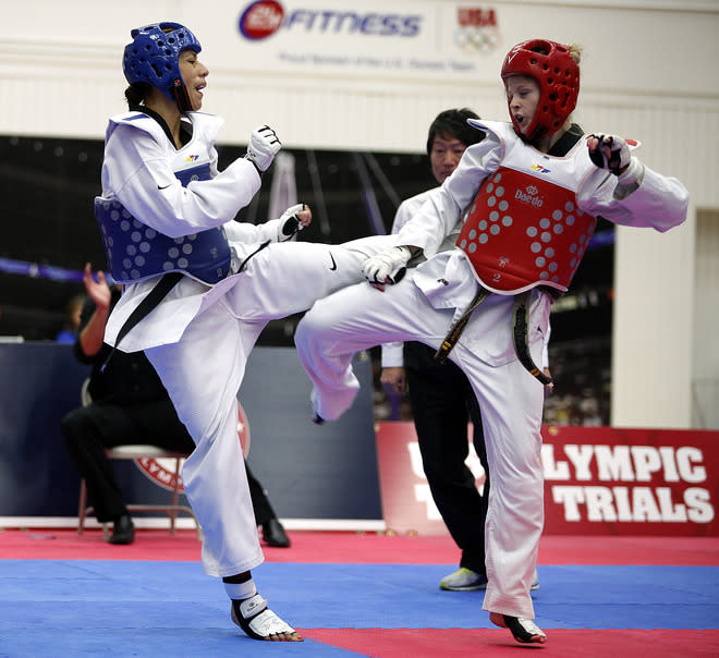 Diana Lopez (blue) squares off against Danielle Holmquist (red) during the 2012 Taekwondo Olympic Trials at the U.S. Olympic Training Center on March 10, 2012 in Colorado Springs, Colorado. Lopez won the match 3-1. (Photo by Marc Piscotty/Getty Images)