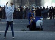 Iraqi demonstrators take part in the ongoing anti-government protests in Kerbala