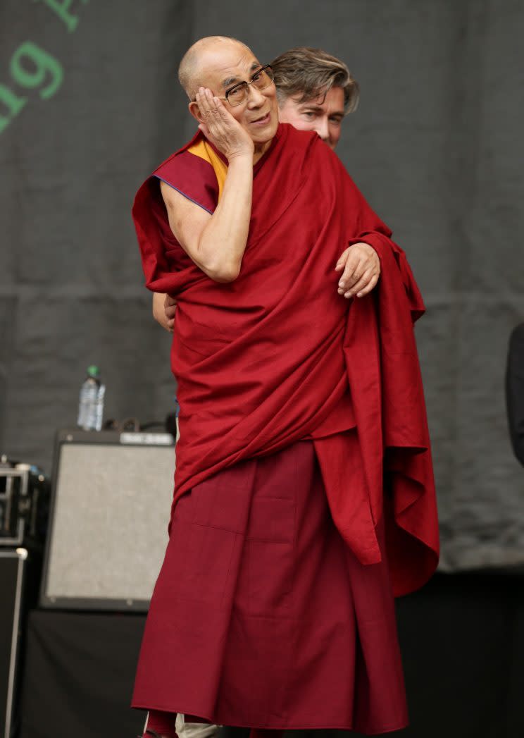 Dalai Lama on the Pyramid stage in 2015 (PA)