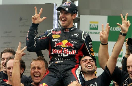 Sebastian Vettel (C) celebrates his Formula One World Championship title with Red Bull teammates after finishing 6th in the Brazilian Grand Prix. But Ferrari gatecrashed Vettel's triple world title party by insisting that Fernando Alonso should have been crowned champion