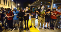 <p>Protesters lock arms outside the Charlotte Police Dept. in Charlotte, N.C., after ignoring the curfew on Sunday, Sept. 25, 2016. (Jeff Siner/The Charlotte Observer via AP)</p>