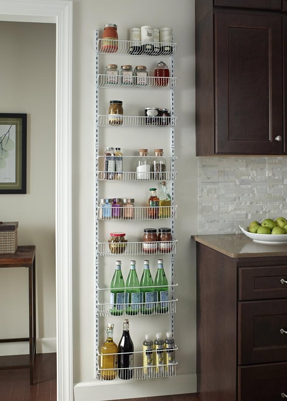 No need to "rack"<i> </i>your brain over how to store food without a pantry. This turns a wall into a place to store all your cans and jars. <br /><br /><strong>Promising review:</strong> "This thing is freaking awesome! <strong>It is so sturdy and can hold some really heavy stuff!</strong> I used the door hooks to hang it on the back of a door. A single person can assemble and mount this easily. I didn't end up using all of the shelves since some of the items I need to store are large and heavy &mdash; I liked having the option of leaving them out and just using as many as I needed. This is a great product and I will buy it again for other closets and storage areas." &mdash; <a href="https://amzn.to/3uYx5PV" target="_blank" rel="nofollow noopener noreferrer" data-skimlinks-tracking="5902331" data-vars-affiliate="Amazon" data-vars-href="https://www.amazon.com/gp/profile/amzn1.account.AHSXW3KBYITABSL3T6GPB56EV3RQ?tag=bfmal-20&amp;ascsubtag=5902331%2C32%2C37%2Cmobile_web%2C0%2C0%2C16540662" data-vars-keywords="cleaning" data-vars-link-id="16540662" data-vars-price="" data-vars-product-id="16013316" data-vars-retailers="Amazon">Chimera</a>﻿<br /><br /><strong>Get it from Amazon for <a href="https://amzn.to/2RDYfx3" target="_blank" rel="nofollow noopener noreferrer" data-skimlinks-tracking="5902331" data-vars-affiliate="Amazon" data-vars-asin="B00D8OYUTM" data-vars-href="https://www.amazon.com/dp/B00D8OYUTM?tag=bfmal-20&amp;ascsubtag=5902331%2C32%2C37%2Cmobile_web%2C0%2C0%2C16540681" data-vars-keywords="cleaning" data-vars-link-id="16540681" data-vars-price="" data-vars-product-id="17912801" data-vars-product-img="https://m.media-amazon.com/images/I/31bg5sduOSL.jpg" data-vars-product-title="ClosetMaid 1233 Adjustable 8-Tier Wall and Door Rack, 77-Inch Height X 18-Inch Wide,white" data-vars-retailers="Amazon">$33.99</a>.</strong>