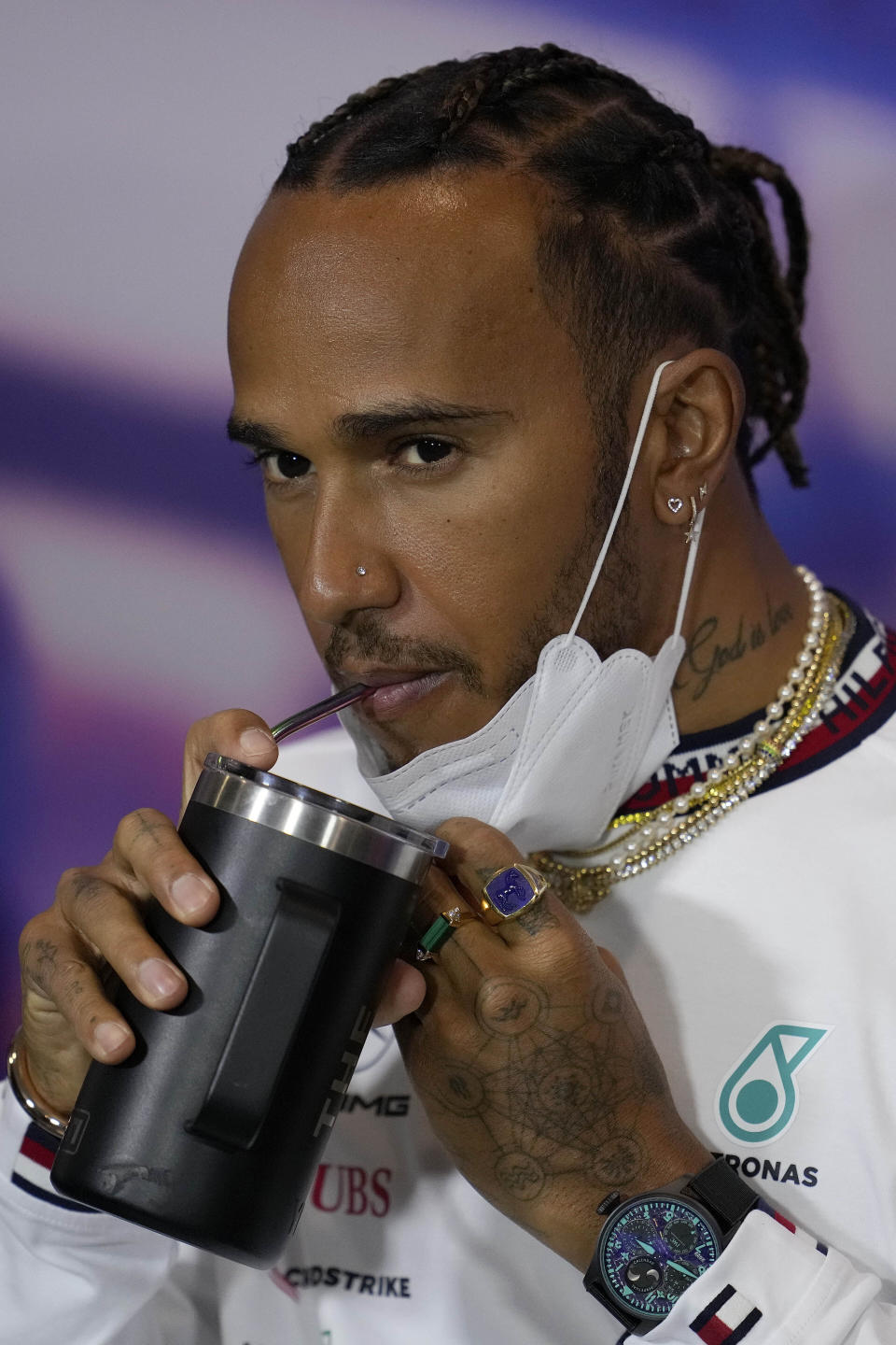 Mercedes driver Lewis Hamilton of Britain drinks during a press conference at the Silverstone race track in Silverstone, Thursday, June 30, 2022. The British F1 Grand Prix is held on Sunday July 3,2022. (AP Photo/Matt Dunham)