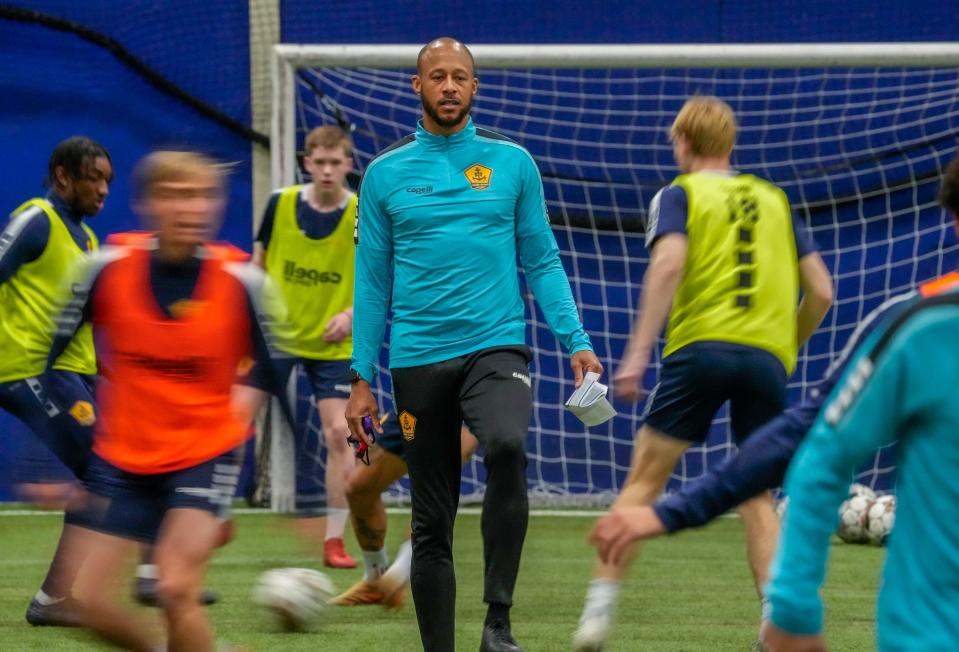 Rhode Island FC coach and general manager Khano Smith runs his team though some drills in January. Home games will be played at Bryant this year until the club’s permanent location, Stadium at Tidewater Landing, is ready to open next year.