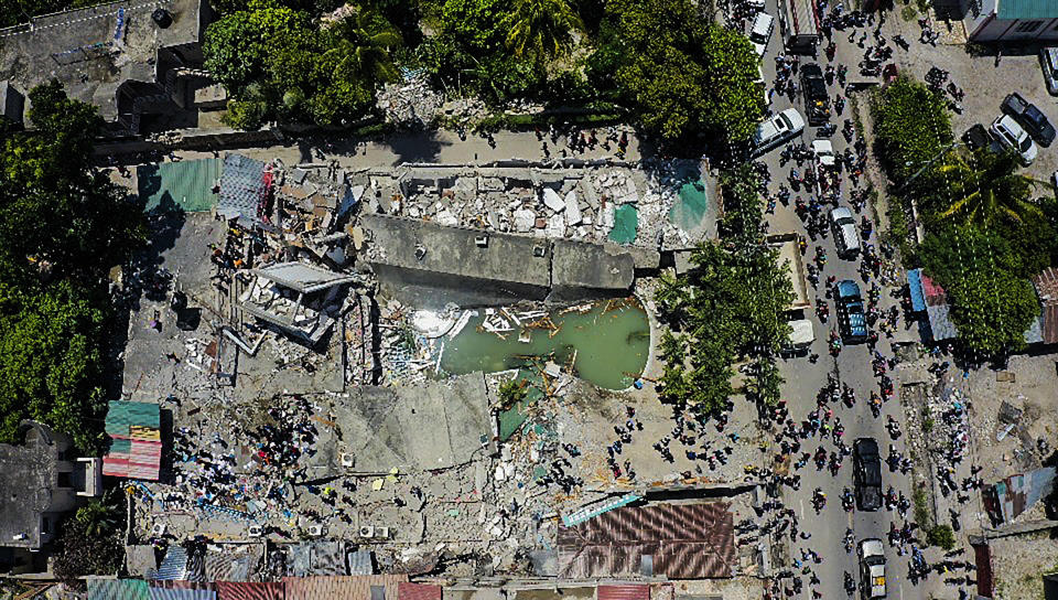 An aerial view of the Hotel Le Manguier destroyed by an earthquake, in Les Cayes, Haiti, Saturday, Aug. 14, 2021. A 7.2 magnitude earthquake struck Haiti on Saturday, with the epicenter about 125 kilometers (78 miles) west of the capital of Port -au-Prince, the US Geological Survey said. (AP Photo / Ralph Tedy Erol)