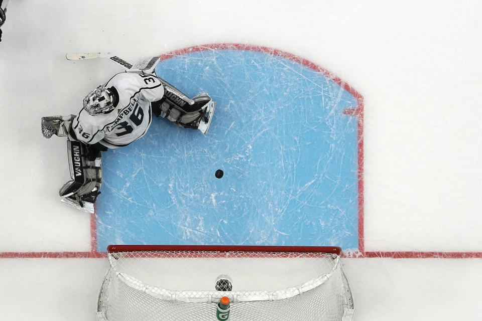 Los Angeles Kings goaltender Jack Campbell (36) can't make the stop on a goal by San Jose Sharks defenseman Erik Karlsson during the first period of an NHL hockey game in San Jose, Calif., Friday, Dec. 27, 2019. (AP Photo/Tony Avelar)