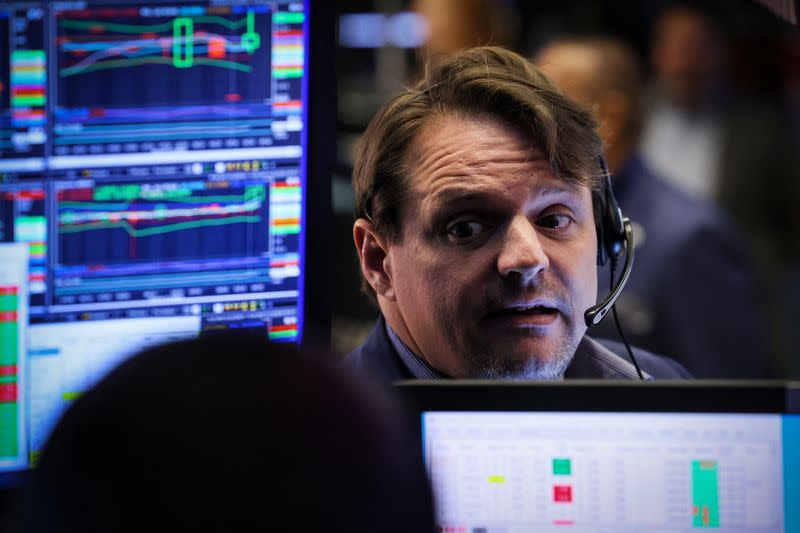 Traders work on the floor of the NYSE in New York