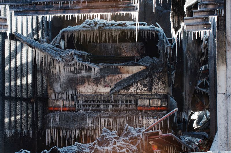 FILE PHOTO: Water forms icicles on a truck are seen after a large fire was extinguished by the New York Fire Department (NYFD) during polar vortex in the Brooklyn Borough of New York