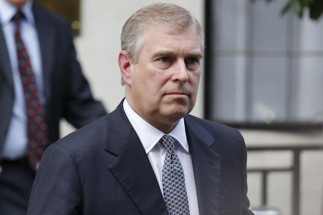 FILE- In this Wednesday, June 6, 2012 file photo, Britain's Prince Andrew leaves King Edward VII hospital in London after visiting his father Prince Philip. Britain’s Prince Andrew, Queen Elizabeth II’s second son, has for years been troubled by reports of his extravagant lifestyle and his friendship with several controversial figures, notably U.S. financier Jeffrey Epstein, a registered sex offender. Andrew stepped down from his role as a trade envoy in 2011 as questions mounted. (AP Photo/Sang Tan, File)