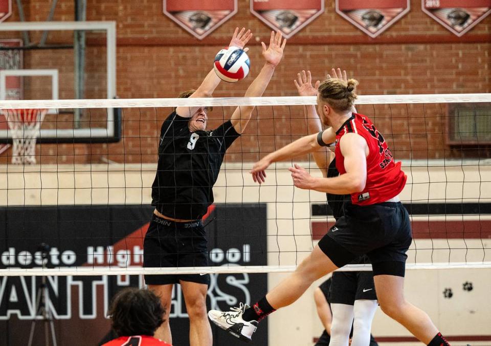 Pitman’s Seth Vink (9) blocks the shot of Modesto’s Cole Rogers during the Central California Athletic League match in Modesto, Calif., Thursday, April 27, 2023. Modesto won the match 3-2.