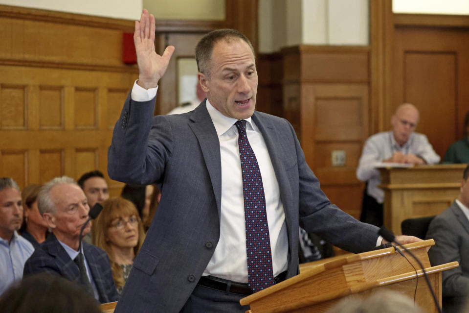 Defense Attorney David Yannetti holds up evidence at the murder trial of Karen Read at Dedham Superior Court on Tuesday, May 7, 2024, in Dedham, Mass. Read is facing charges including second degree murder in the 2022 death of her boyfriend Boston Officer John O’Keefe. (Stuart Cahill/The Boston Herald via AP, Pool)