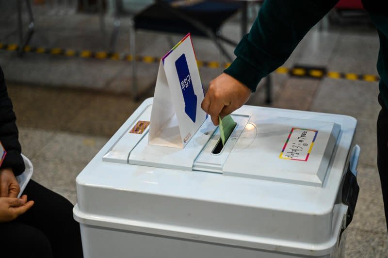 A voter casts his ballot Wednesday in South Korea's National Assembly general election. Photo by Thomas Maresca/UPI