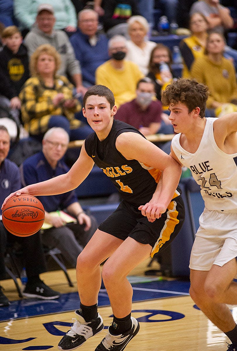 Colonel Crawford's Braxton Baker looks to dribble around Carey's  Brayden Young.