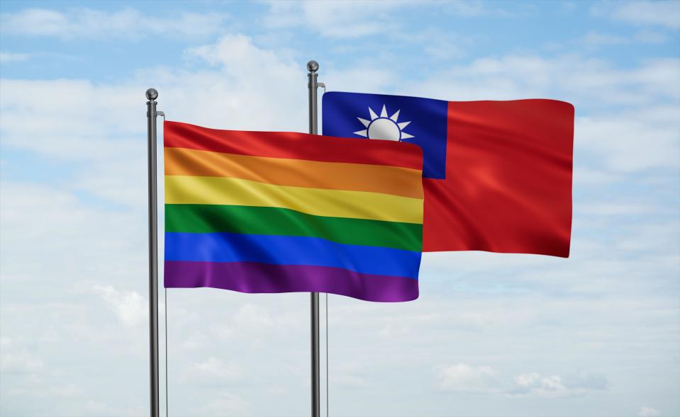 Taiwan and LGBT movement flag also Gay Pride flag waving together in the wind on blue sky, tolerance to LGBT in country conception