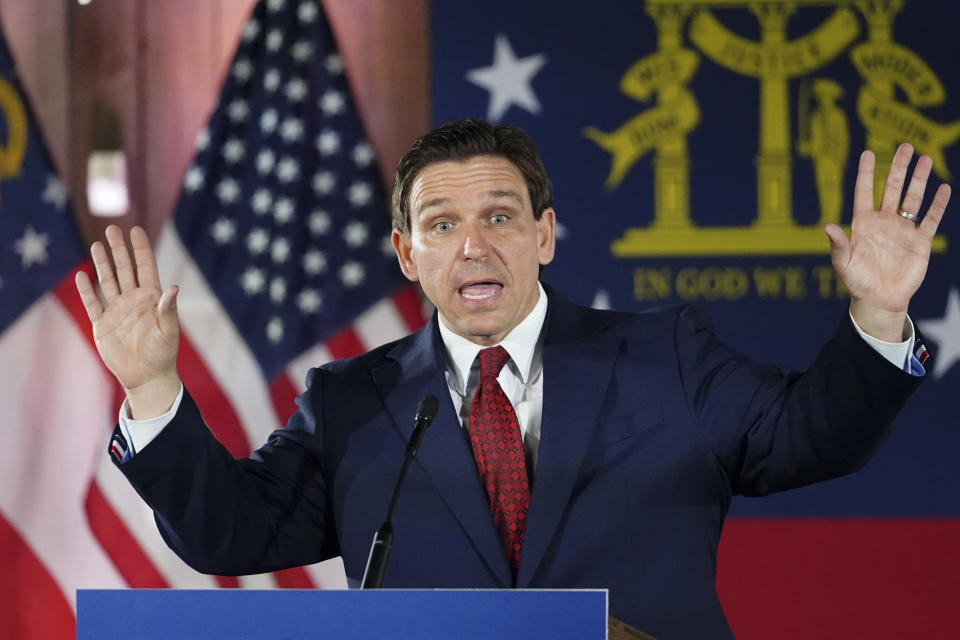 Florida Gov. Ron DeSantis speaks to a crowd at an Adventure Outdoors gun store on March 30 in Smyrna, Ga.