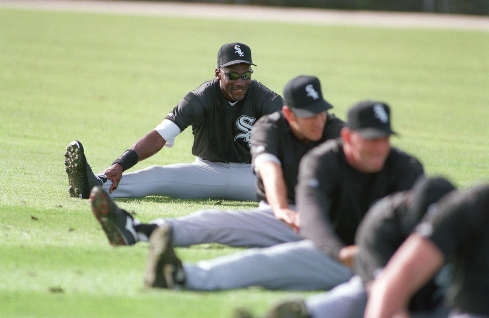 Michael Jordan stretches during the first day of the Chicago White Sox spring training workouts, Saturday, Feb. 18, 1995, Sarasota, Fla. (AP Photo/Pat Sullivan)