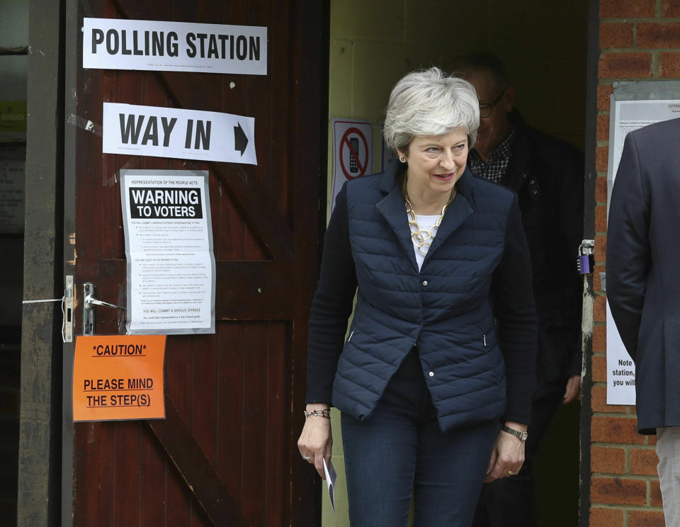 Britain's Prime Minister Theresa May leaves after casting her vote at a polling station near her home in the Thames Valley as voters headed to the polls for council and mayoral elections across England and Northern Ireland Thursday May 2, 2019. (Andrew Matthews/PA via AP)