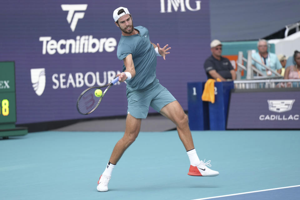 Karen Khachanov, of Russia, returns a volley against Daniil Medvedev, of Russia, in the first set of a match at the Miami Open tennis tournament, Friday, March 31, 2023, in Miami Gardens, Fla. (AP Photo/Jim Rassol)