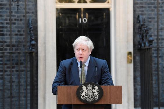 Boris Johnson speaks from outside 10 Downing Street after being returned to power (REUTERS)