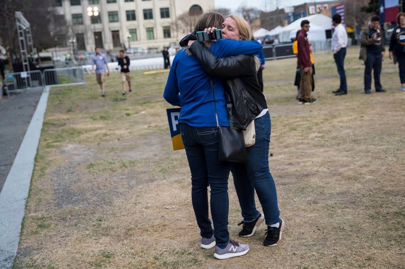 Supporters react to reports of Democratic 2020 U.S. presidential candidate former South Bend, Indiana Mayor Pete Buttigieg suspending his candidacy as they gather before a rally in Dallas