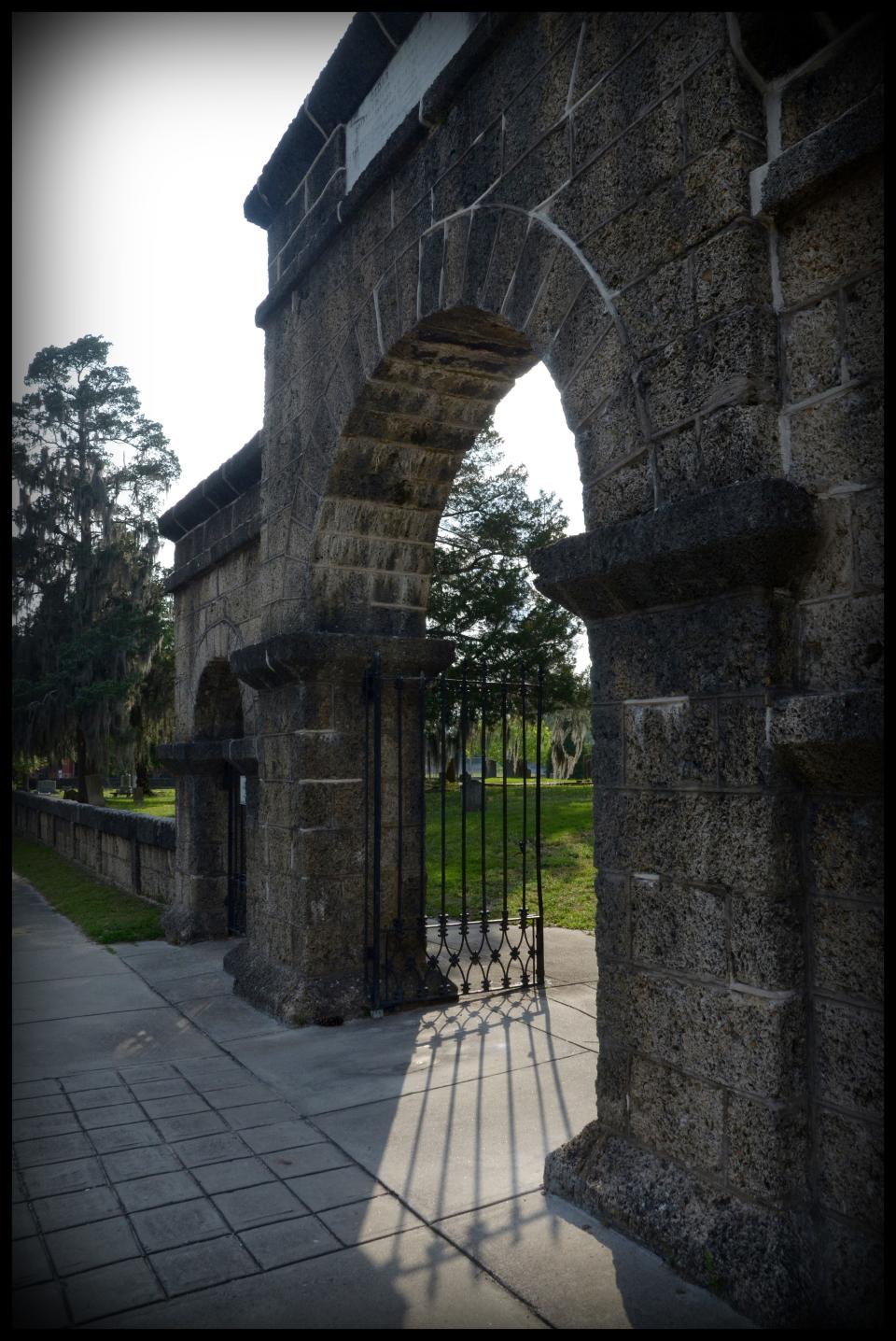 The cemetery's famous entrance arch is the subject of a damp, and possibly deadly, legend.