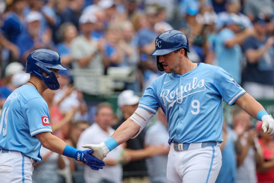 Kansas City Royals first base Vinnie Pasquantino (9) slaps hands with a teammate after hitting a home run during the first inning against the Cleveland Guardians at Kauffman Stadium on Jun 28, 2024 in Kansas City, Missouri, USA.