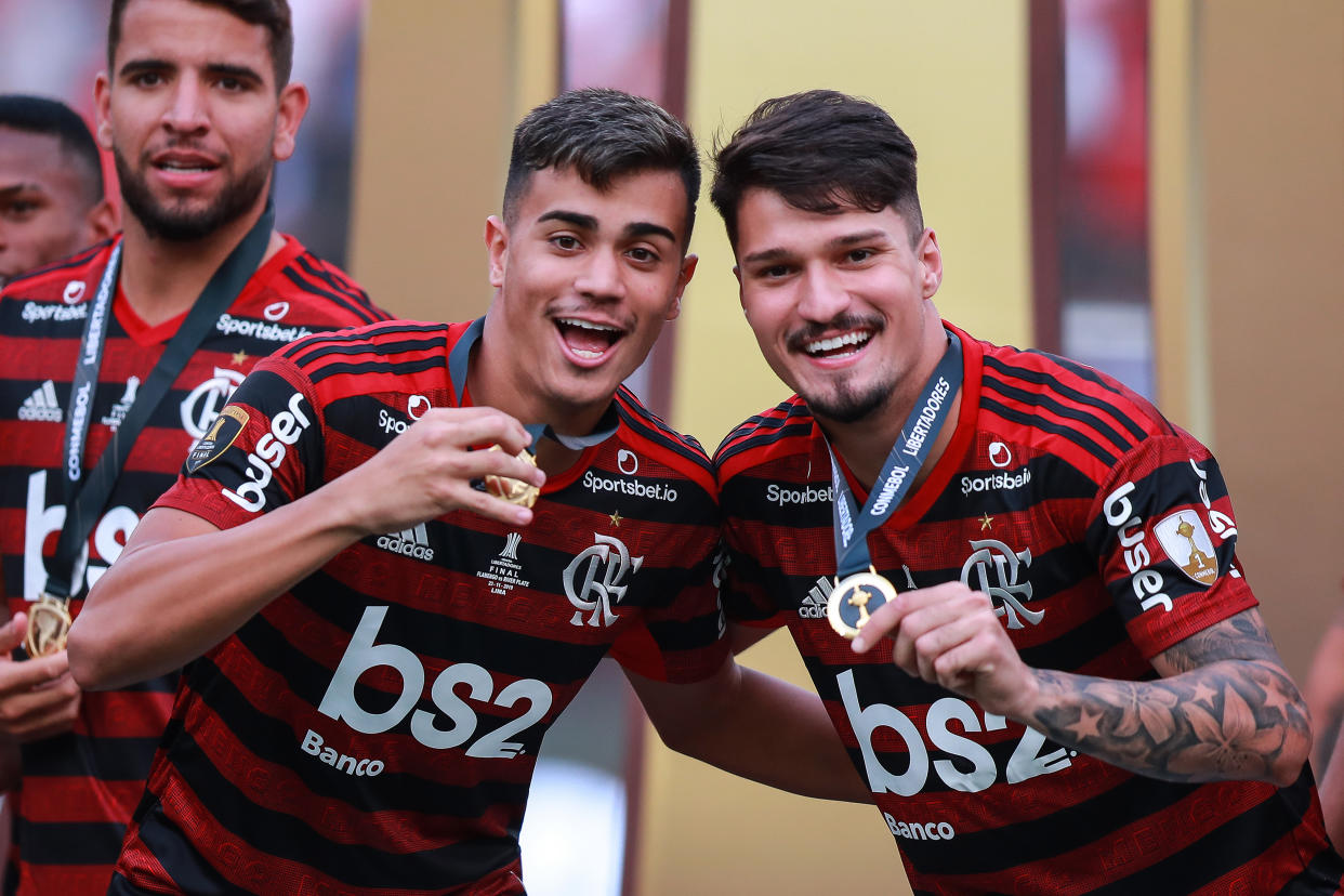 LIMA, PERU - NOVEMBER 23: Reinier Jesus #19 and Matheus Soares #26 of Flamengo celebrates the victory after winning the final match of Copa CONMEBOL Libertadores 2019 between Flamengo and River Plate at Estadio Monumental on November 23, 2019 in Lima, Peru. (Photo by Manuel Velasquez/Getty Images)