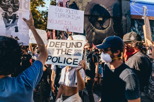 <span class="caption">Calls to 'defund the police' are growing across the US. </span> <span class="attribution"><a class="link " href="https://www.shutterstock.com/image-photo/san-francisco-california-usa-june-03-1749068324" rel="nofollow noopener" target="_blank" data-ylk="slk:hkalkan via Shutterstock;elm:context_link;itc:0;sec:content-canvas">hkalkan via Shutterstock</a></span>