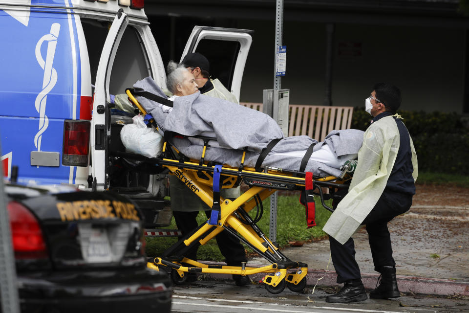 FILE - This April 8, 2020, file photo shows a patient being evacuated from the Magnolia Rehabilitation and Nursing Center in Riverside, Calif. After months spent tamping down surges and keeping the coronavirus at manageable levels, a variety of factors combined to bring California to a crisis point in the pandemic. (AP Photo/Chris Carlson, File)