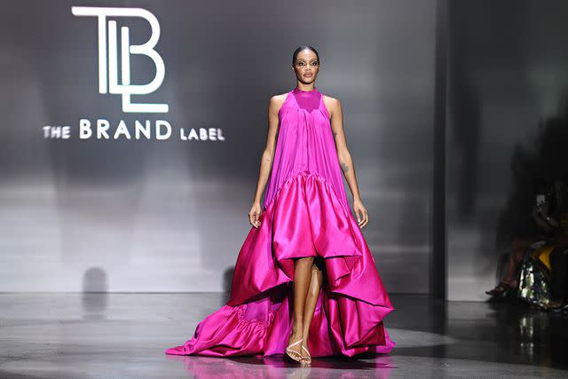 <p>Bryan Bedder/Getty</p> A model walks the runway for The Brand Label during BIG MOTION: an HBCU Runway
