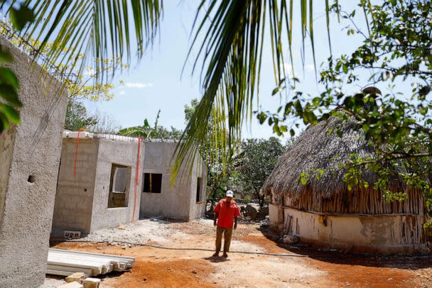 PHOTO: Gumersindo Martinez, 68, walks next to an unfinished house after his house was demolished to build section 2 of the new Mayan Train route, in Tenabo, Campeche, Mexico, May 14, 2022. (Jose Luis Gonzalez/Reuters)