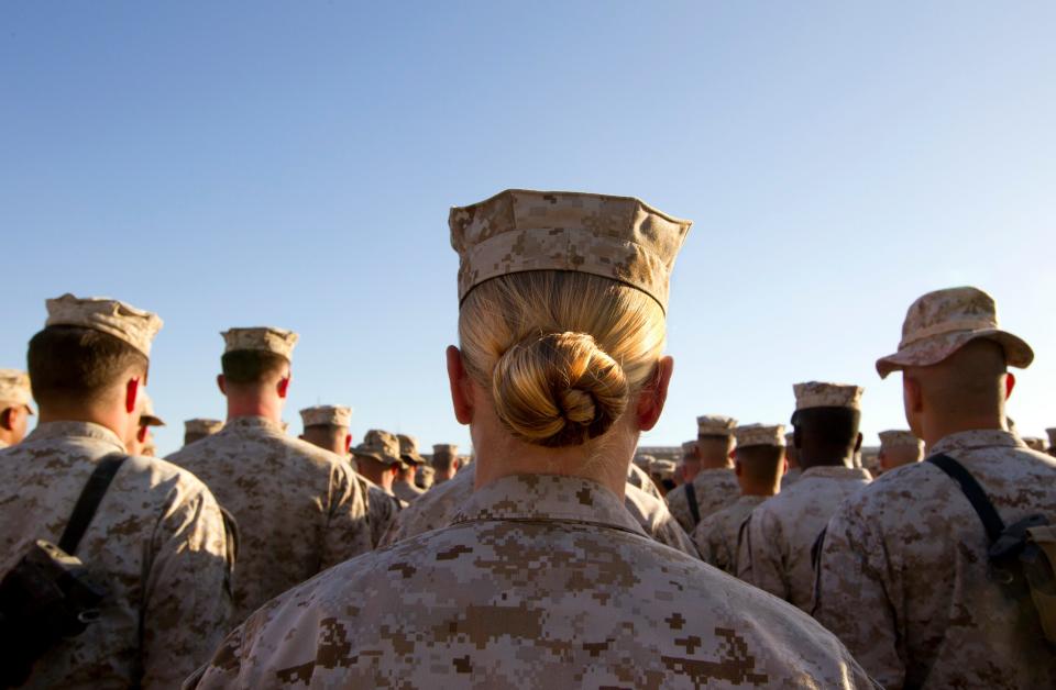 Marines stand in formation during a ceremony in November 2010 at Camp Delaram in Helmand province, Afghanistan.