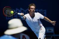 Filippo Volandri of Italy hits a return during his men's singles match against Jo-Wilfried Tsonga of France at the Australian Open 2014 tennis tournament in Melbourne January 14, 2014. REUTERS/David Gray