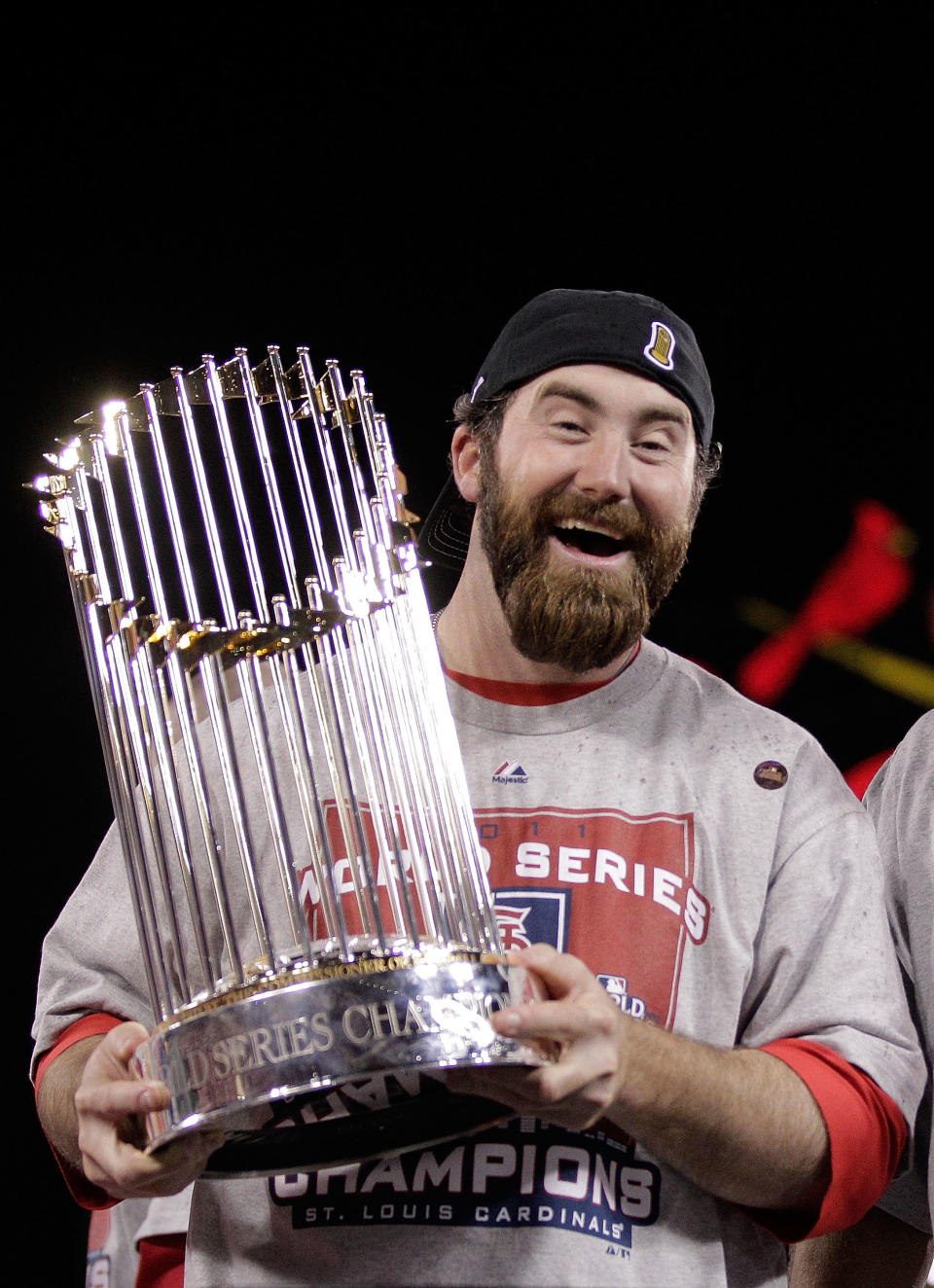 ST LOUIS, MO - OCTOBER 28: Jason Motte #30 of the St. Louis Cardinals celebrates with the World Series trophy after defeating the Texas Rangers 6-2 in Game Seven of the MLB World Series at Busch Stadium on October 28, 2011 in St Louis, Missouri. (Photo by Charlie Riedle-Pool/Getty Images)