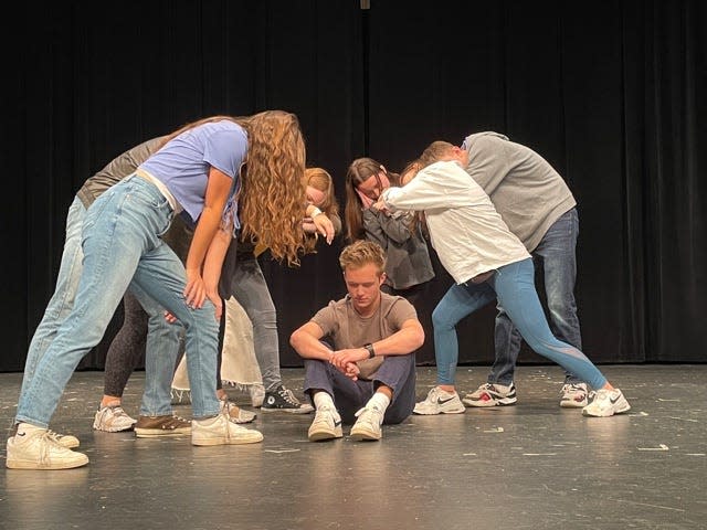 The opening sequence features dancers surrounding Mason Cross as Joe doing an artistic interpretation of “Tumble out of bed and stumble to the kitchen” during a rehearsal of “9 to 5” held at Farragut High School Tuesday, Nov. 23, 2021.