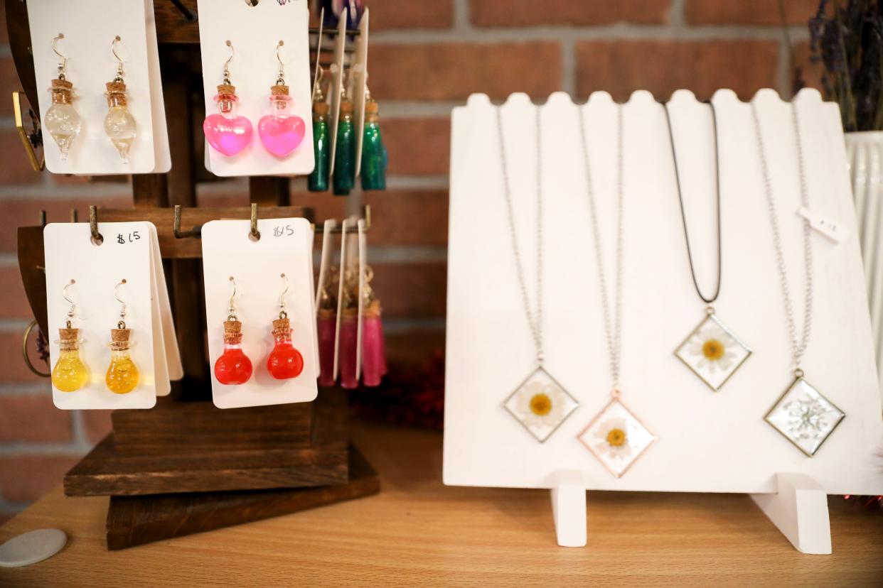 Handmade earrings and necklaces are sold at The Little Pumpkin Cat Cafe on Dec. 1 in Independence.